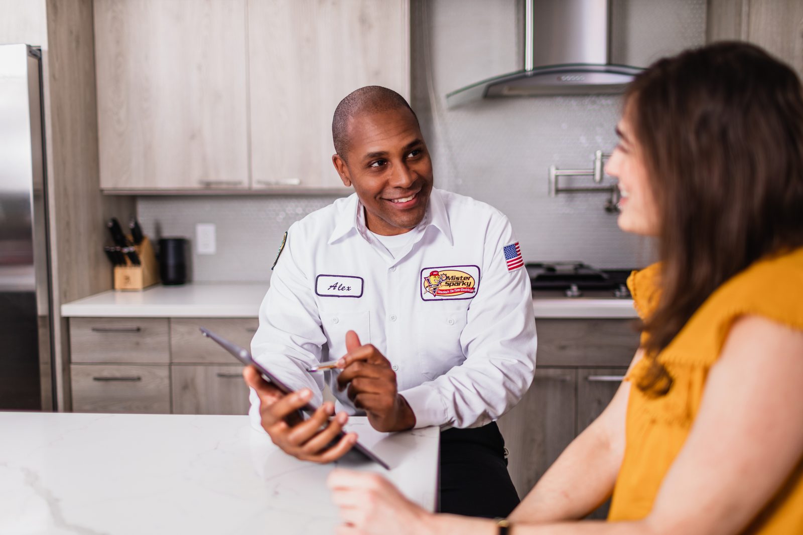 Northern Mister Sparky electrician reviewing financing options with a Twin Cities homeowner